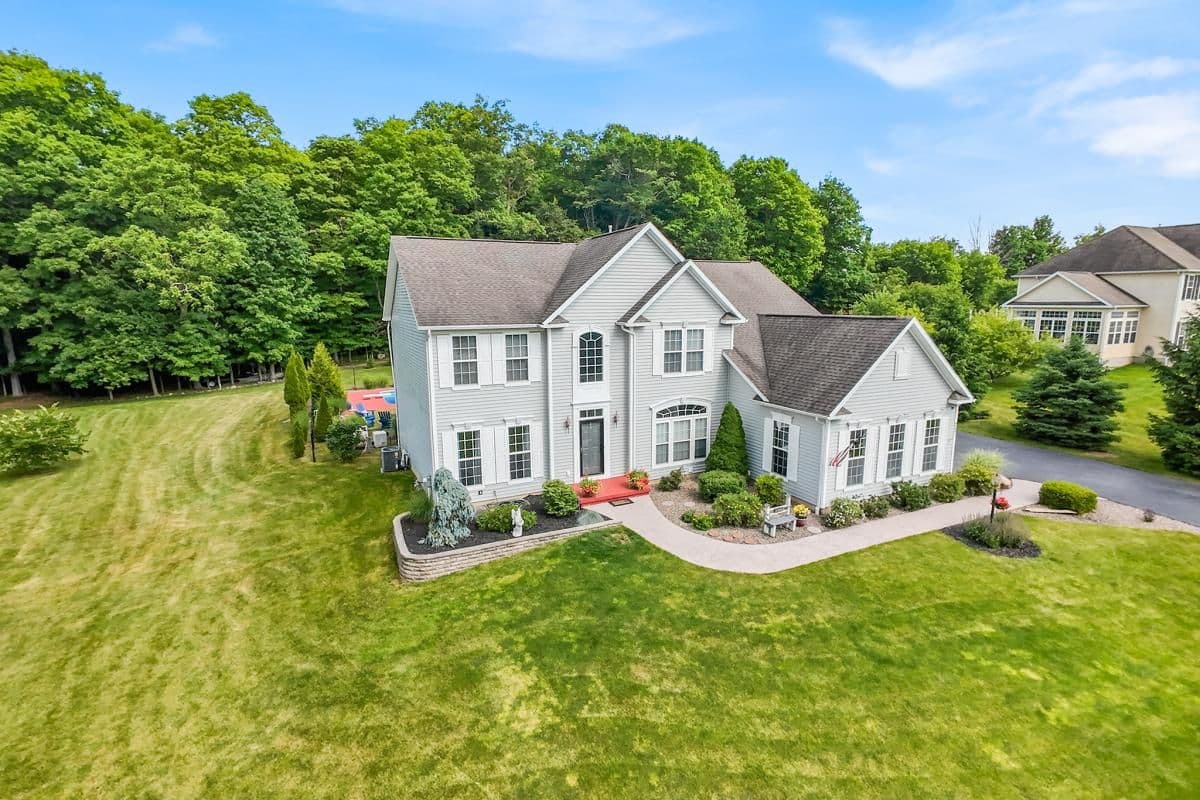 Aerial of a home and long driveway