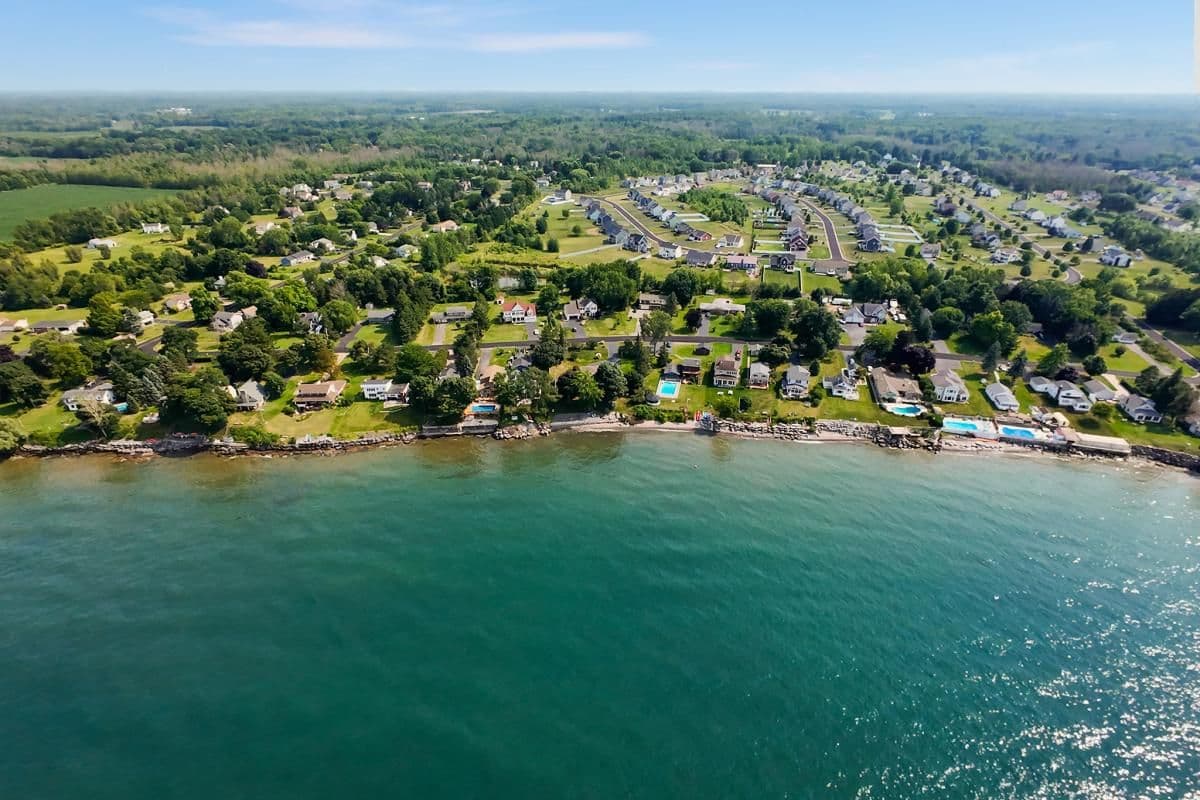 Aerial view of a lakeside neighborhood and shoreline