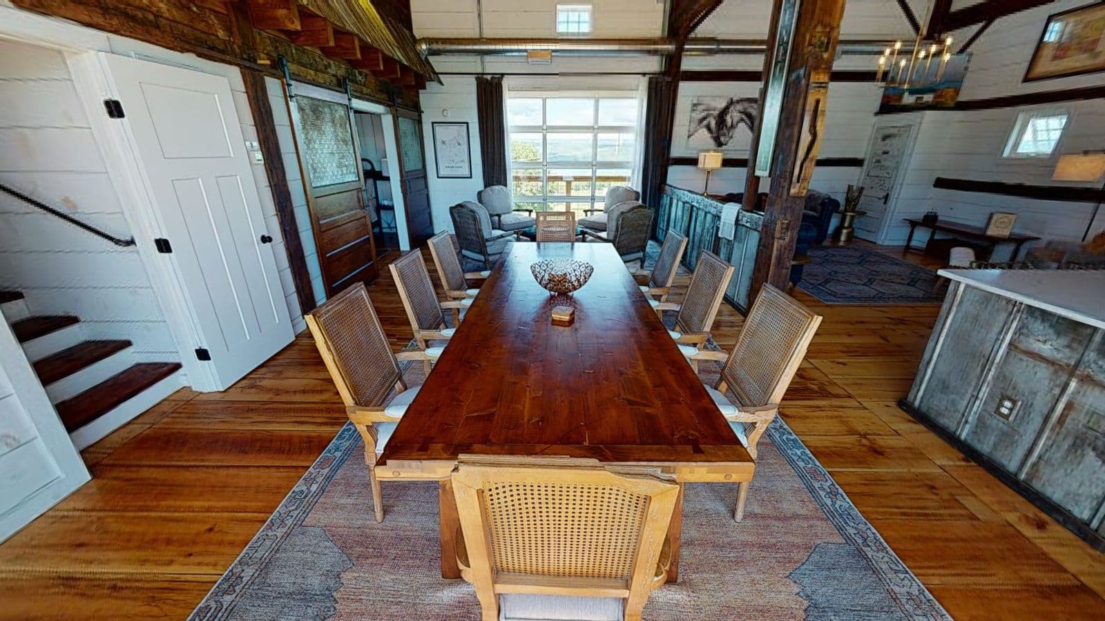 Long dining table under barn beams